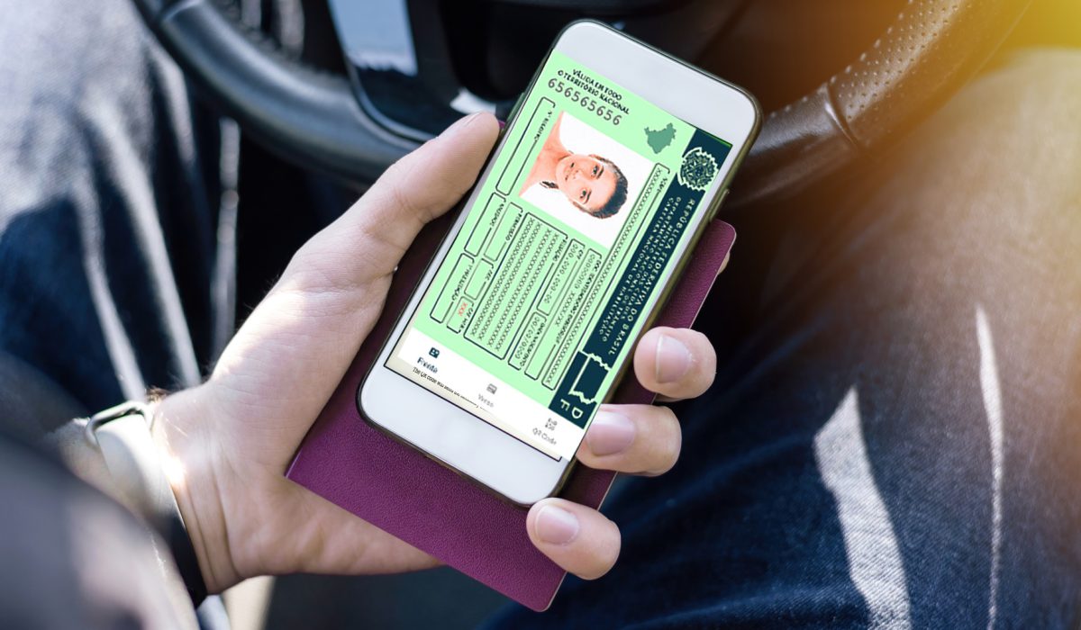male-hand-holding-passport-smartphone-with-international-vaccination-certificate-covid-19-qr-code-car